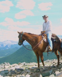 Author Talmage Bachman on horseback in the Alberta Rockies.