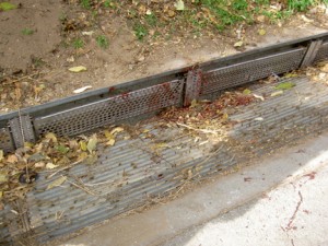 Bent metal is just one sign of the recent trauma cased by an L.A. storm drain, seen bloodied after a riding accident.