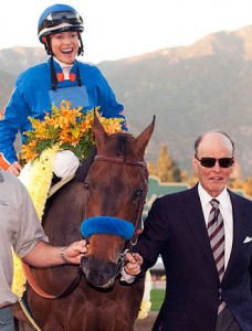 Lanni escorts Game On Dude and jockey Chantal Sutherland into the winner's circle at the $750,000 Santa Anita Handicap in March. (Benoit Photo)