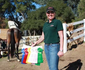 Trainer Erin Rorabaugh of Fairview Farms poses with show ribbons.