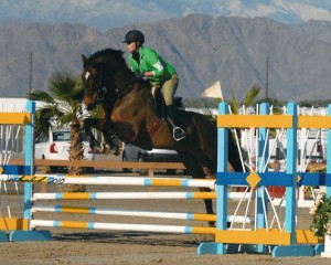 Pepperdine senior Evanne Lindley rides her bay horse Bosch in a jumper class at HITS Thermal.